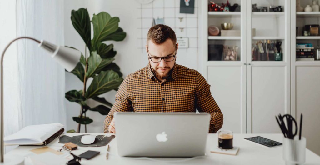 Man working in front of a laptop