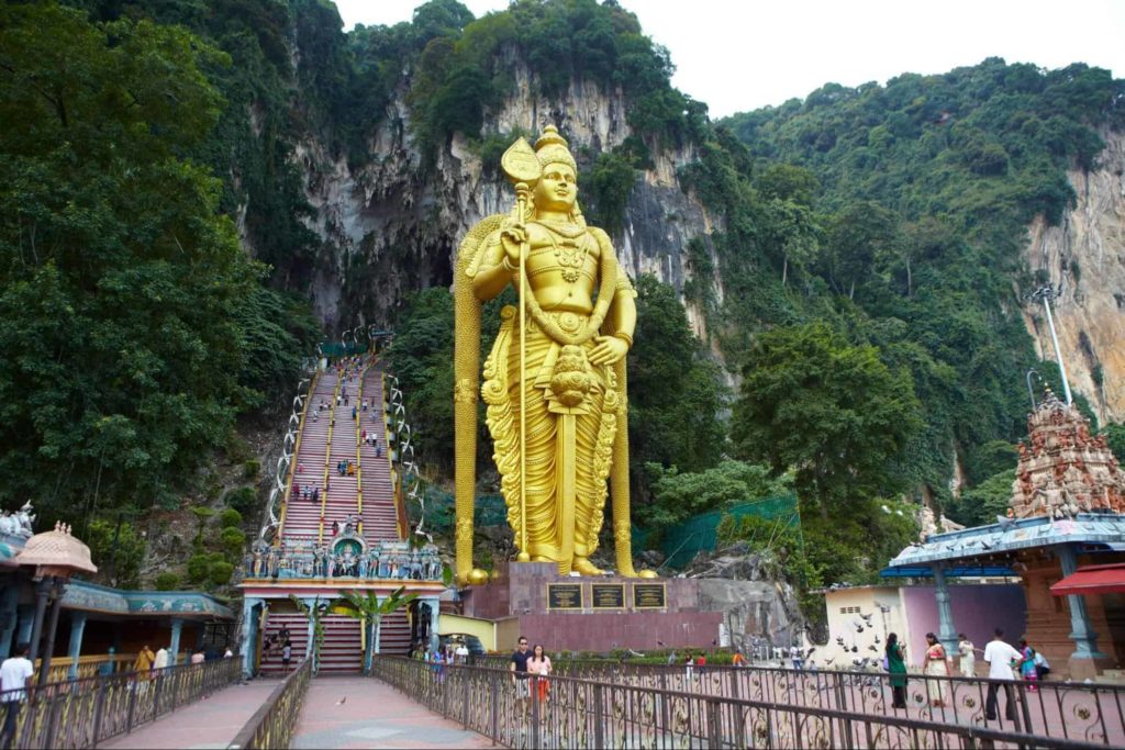 Climb the 272-step staircase at Batu Caves