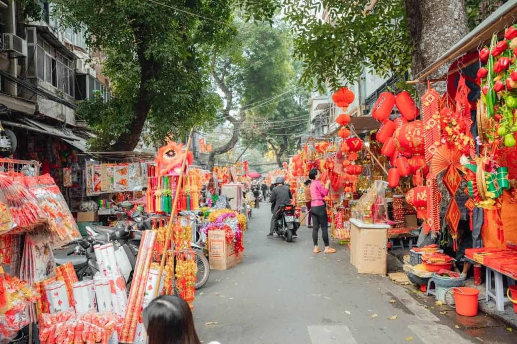 Malaysians celebrate on the streets with lion dances and firecrackers