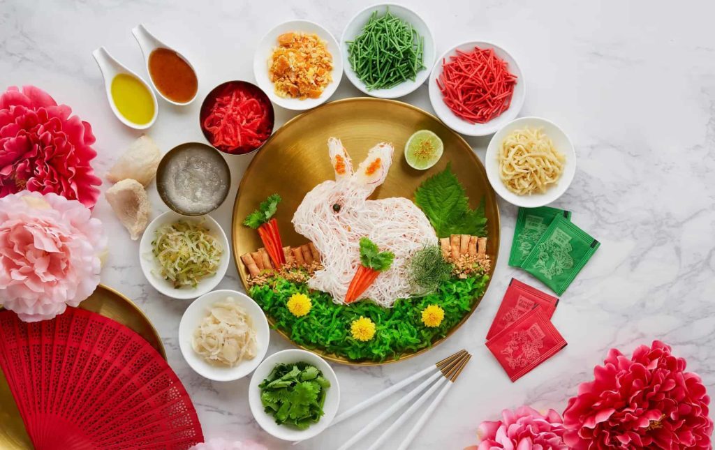 Yee Sang is eaten and tossed in the air